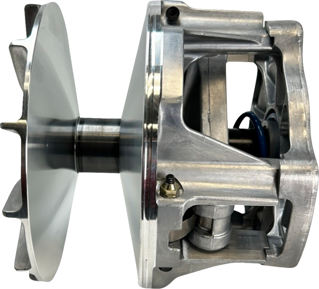 A close-up side view of a metallic mechanical component, likely a clutch or pulley system. The part features a smooth, shiny disc on one side and an open, sturdy aluminum housing with visible internal mechanisms, bolts, and a blue circular element.