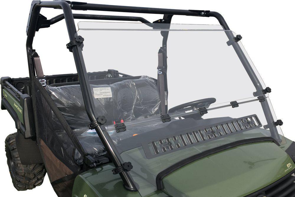 A John Deere Gator HPX 4X4, XUV 620i/625i/825i/825M/850D/855D hard-coated, scratch-resistant hinged windshield with vents (2007+) is mounted on a green UTV cab with a steering wheel, black seats, and black clamps securing the windshield.