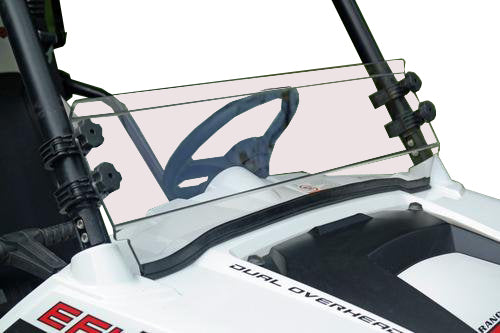 A Polaris Rzr 570/800/900 Short Shield-Hard Coated Scratch Resistant windshield is mounted on an off-road vehicle, attached with black brackets. The steering wheel and dashboard are visible behind the shield; background is plain white.