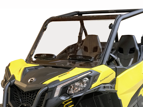 A close-up of a Can Am Maverick Trail (2018+) with a hard-coated, scratch-resistant windshield featuring dual vents, two black seats, safety bars, visible dashboard details, headlights, and “1000R” hood label.