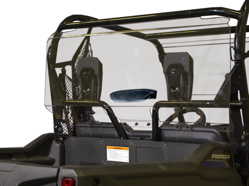 A close-up of a Honda Pioneer 700 Rear Vented Windshield installed on a black utility vehicle shows two headrests, interior safety netting, the Pioneer logo, and a visible safety label.