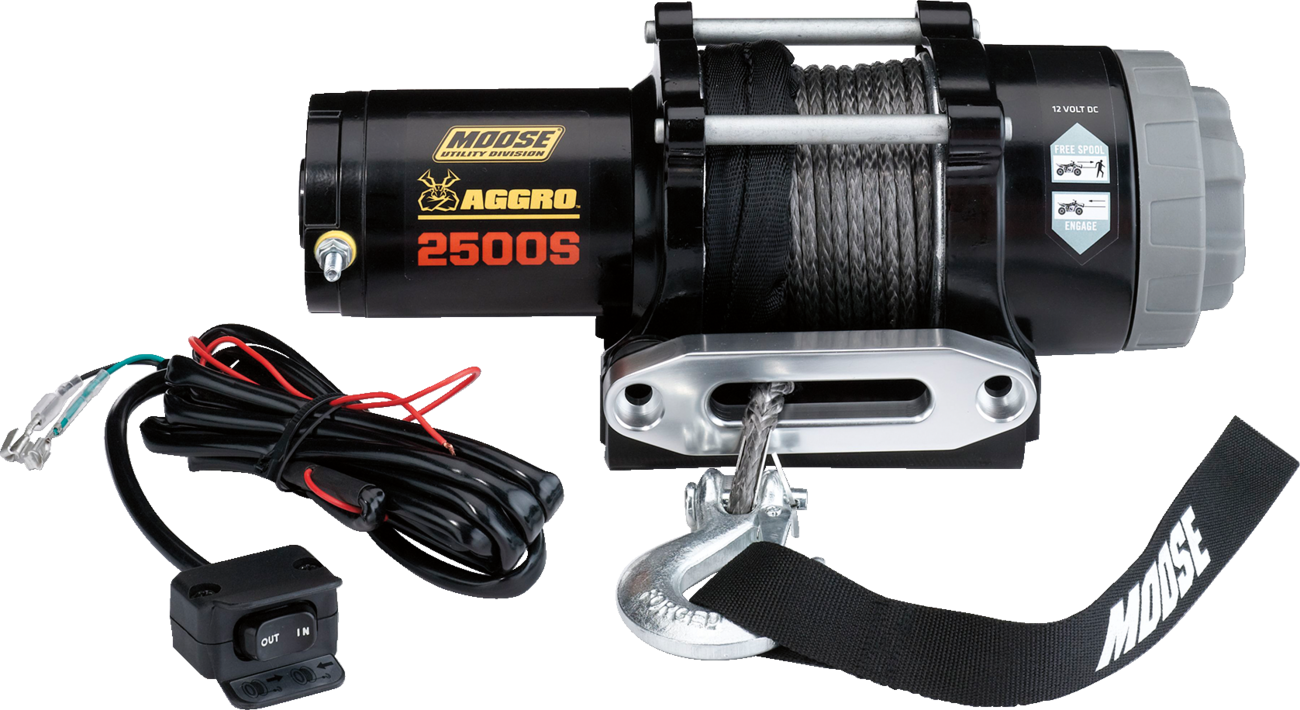 A black electric winch labeled “Moose Utility Division Aggro 2500S” with a gray spool of cable, a metal hook, a black and white strap, and an attached wired remote control with toggle switch and power cables.