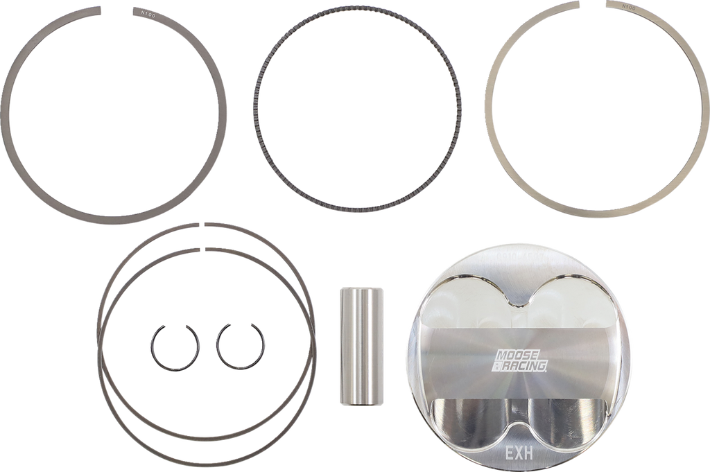A piston kit is shown, including a metallic piston labeled MOOSE RACING EXH, two circular snap rings, a wrist pin, and several piston rings of different thicknesses, all neatly laid out on a white background.