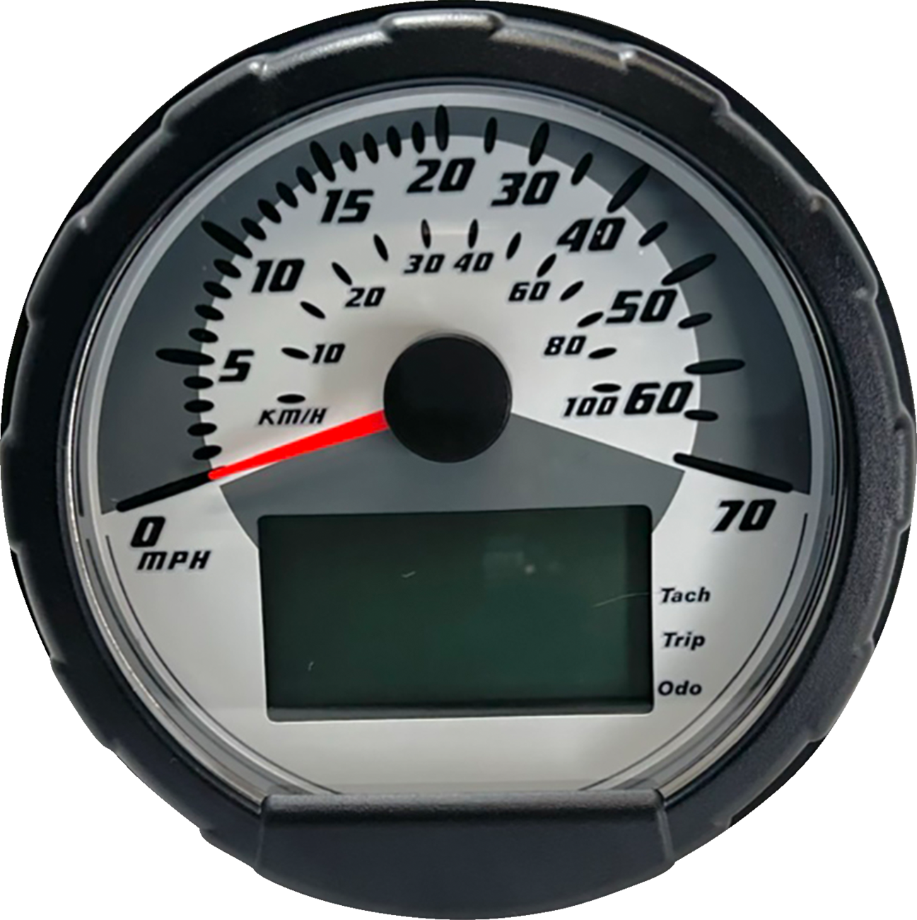 A close-up of a round speedometer with a black outer rim. The dial shows speeds from 0 to 70 in large black numbers, labeled MPH, with a smaller KM/H scale. A red needle points to 5 MPH. There is a digital display and indicators for tach, trip, and odo at