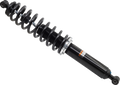 A black automotive shock absorber with a tightly coiled spring wrapped around its body is shown against a white background. The metal spring surrounds the cylindrical shock, which has a mounting eyelet at one end and a label with text on its side.