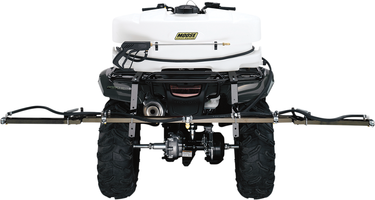 A rear view of an ATV equipped with a white Moose brand sprayer tank and wide spray boom mounted above the large rear tires. Hoses and spray nozzles are visible, designed for agricultural or lawn spraying tasks.
