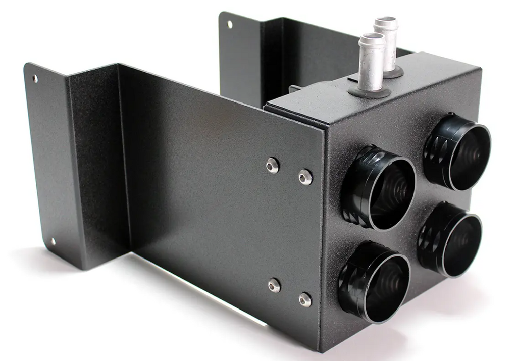 The Inferno Cab Heater Kit With Defrost for 2014-Current Kawasaki Teryx Teryx4 800 is a black metal rectangular unit featuring four round ports on one side, two vertical silver connectors on top, and side flanges with mounting holes for installation.