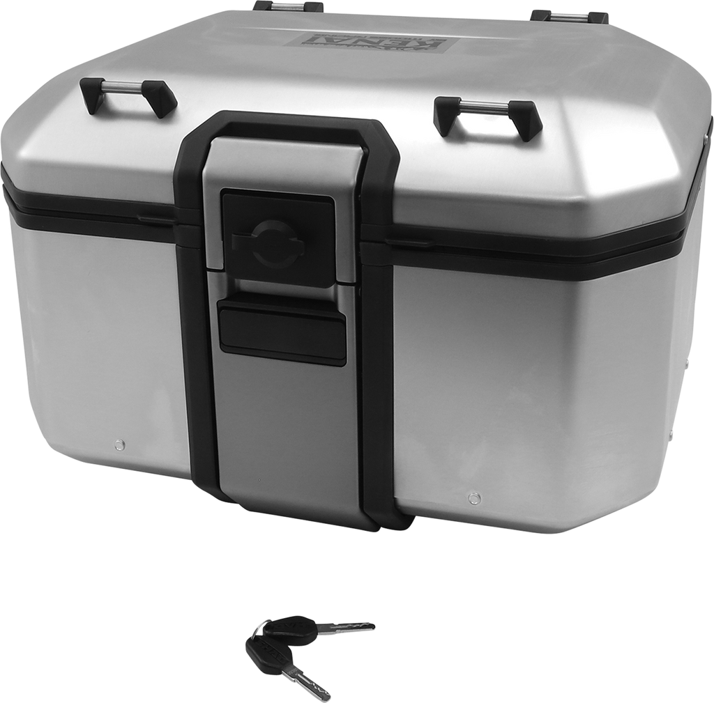 A silver, rectangular motorcycle top case with black trim and latch sits closed; two black keys rest on the white surface below, positioned near the front of the case. Four black mounting points are visible on the corners of the case’s lid.