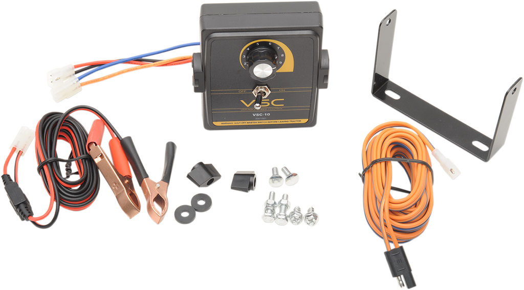 A vehicle speed controller kit includes a black control box with a dial, a metal mounting bracket, assorted screws and bolts, red and black battery clamp cables, and a long orange and black cord, all laid out on a white background.