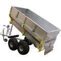 A large silver metal Offroad Trailer 2600lb Capacity w/ 2 Ball Hitch features chunky black tires, a tilting dump bed, yellow hinges and reinforcements, plus a front hitch for towing. OFFROAD PRO 1200 is labeled on the side.