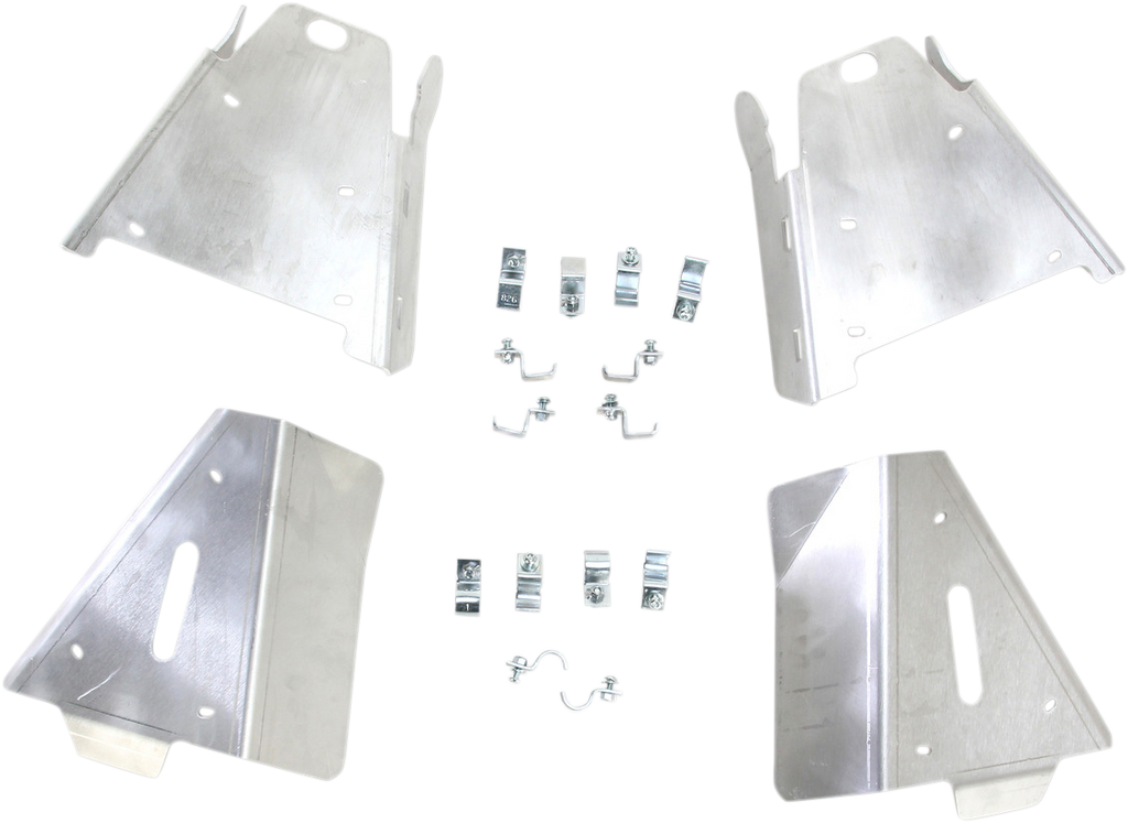 Four metal plates with pre-cut holes and slots are arranged in a square. Between them are small metal brackets, clips, bolts, and fasteners, all organized symmetrically on a white background. The plates appear to be automotive or machinery components.