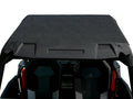 Polaris Rzr 900/1000 ABS Roof, compatible with 2014+ Rzr 1000, 2015+ Rzr 900, and NA Turbo-S, shown installed on a UTV. View from above and behind shows two black seats under the roof and parts of the red frame. White background.