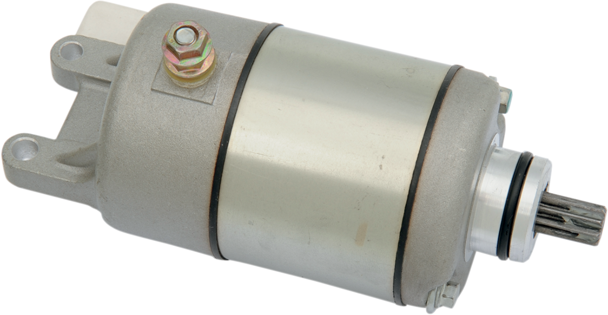 A cylindrical metal starter motor with a silver body, black rings near each end, a protruding gear on one end, and a mounting bracket with a bolt and nut on top, designed for use in automotive or small engine applications.