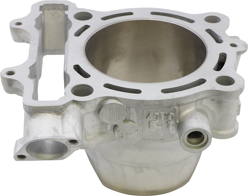 A close-up view of a metallic engine cylinder, showing a cylindrical chamber with smooth inner walls, several bolt holes around the top rim, and intricate outer casing with various machined openings and connectors on a plain white background.