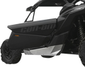 A close-up side view of a black Can-Am off-road vehicle, focusing on the door with can-am text in gray. The vehicle has rugged tires, a visible suspension coil, and a metallic silver skid plate beneath the door for protection.