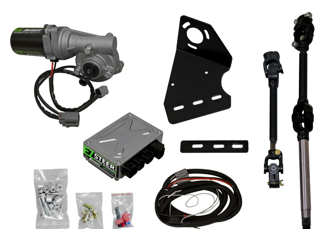 The Polaris Ranger XP 900 Power Steering Kit is displayed on a white background, featuring a motor unit, black mounting bracket, control module, wiring, steering shafts with joints, and hardware packs with bolts, nuts, and connectors.