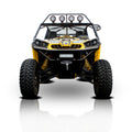 A Can Am Commander HMF Front Heavy Duty Bumper (2011-2020) is displayed from the front, showing off its rugged build and visible suspension, with large tires and a reflection below on a white background.