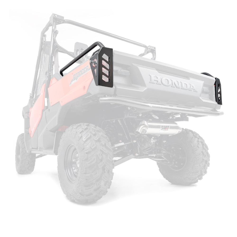 Rear angled view of a red Honda Pioneer 1000 (2016+) with HMF black taillight guards, large rugged tires, roll cage, and a prominent rear bumper. The faded body emphasizes the taillight guards and rear suspension.