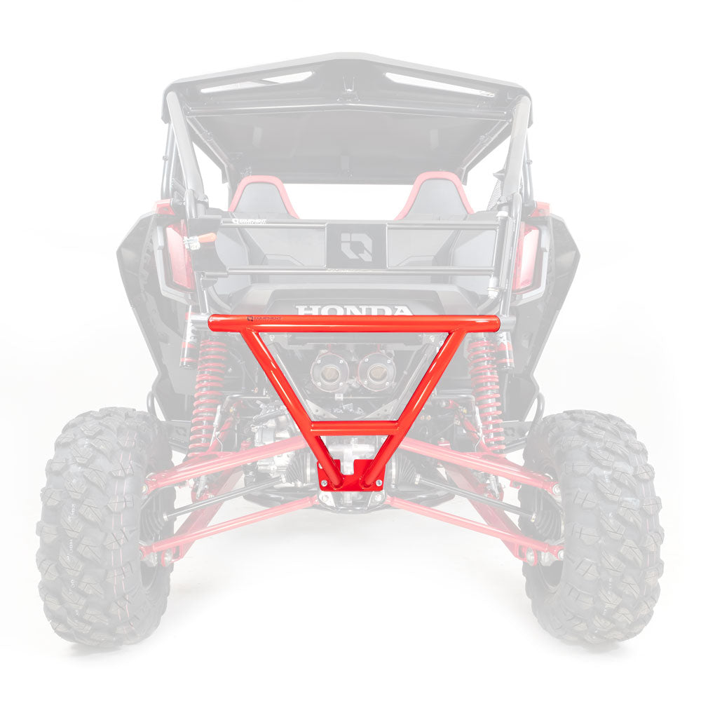 A rear view of a black and red Honda Talon 1000R/X (2019+) shows the HMF Defender Rear Bumper in bright red, highlighted in sharp focus, while the rest of the off-road vehicle appears faded and out of focus.