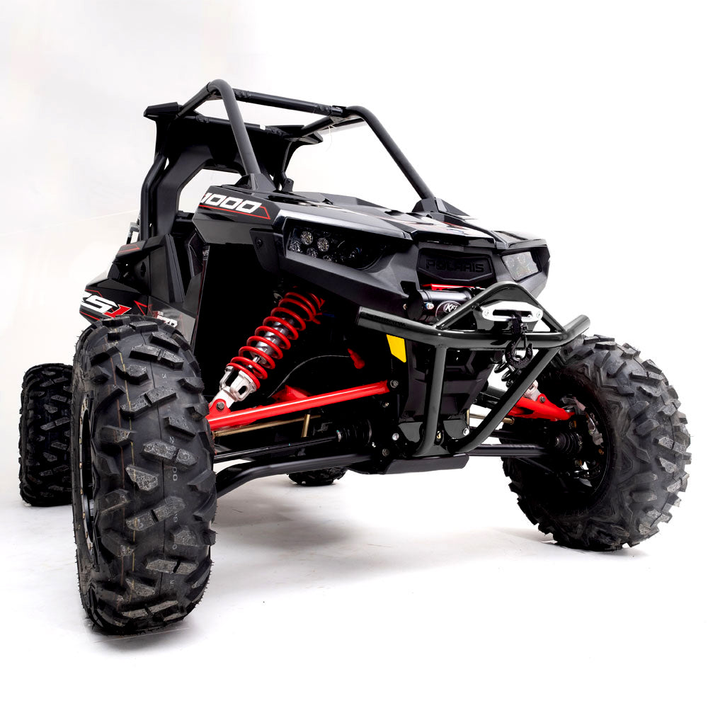 A Polaris Rzr Rs1 Hmf Defender Front U4 Bumper (2018+) is shown in black with large rugged tires, red suspension springs, a sturdy roll cage, and angular headlights, viewed from a low front angle against a white background.