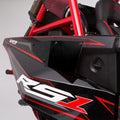 Close-up of a Polaris Rzr RS1 HMF Radiator Scoop (2018+) panel in black and red with bold RS1 lettering. Visible features include red chassis bars, air filter, vehicle seat, and partial ProStar branding in the background.