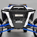 Close-up of a Polaris Rzr Turbo | S | Xp1K Hmf Defender Front Heavy Duty Bumper (2019+) featuring a black metal bumper, LED light bar, white and blue suspension parts, large tires, and skid plate against a neutral gray background.