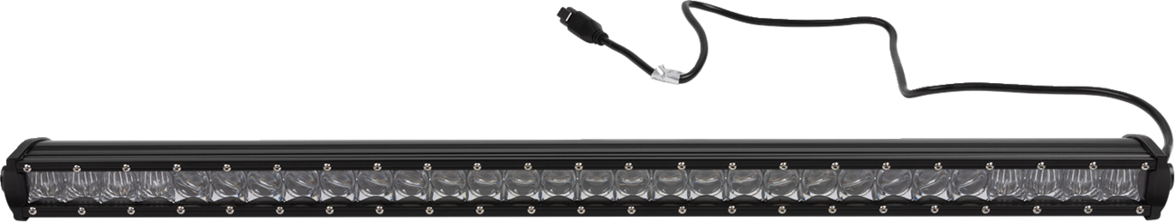 A long, black LED light bar with a row of clear, rectangular lenses, each framed by small screws. A black power cable extends from one end, ending in a connector. The light bar is isolated on a plain, light background.