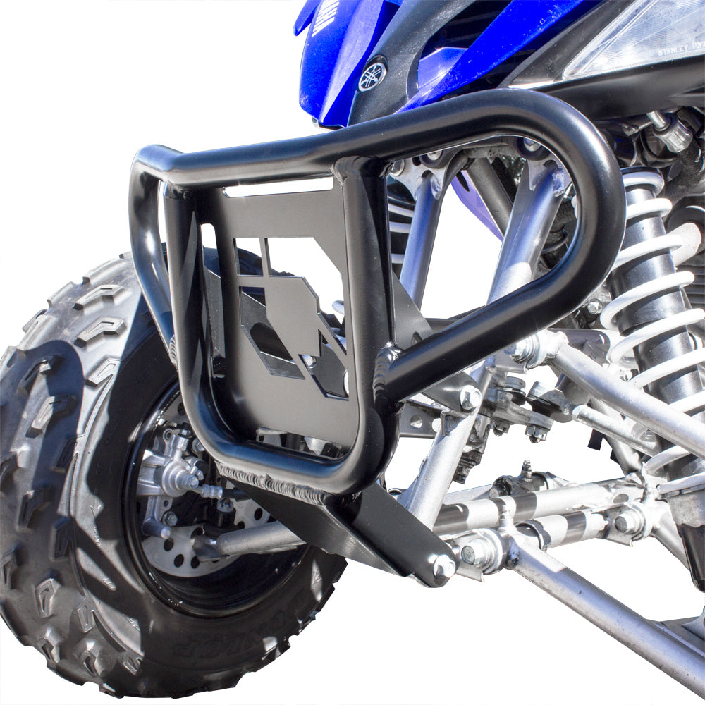 Close-up of a Yamaha Raptor 125/250 (2008-2013) HMF Defender Front MX/XC Bumper in black, showing the geometric cutout with blue and silver bodywork and visible suspension components behind the bumper.