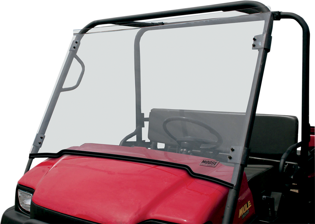 A red utility vehicle with a transparent windshield and a black metal frame. The interior shows a steering wheel and seats. A small sticker with the word MOOSE is visible on the lower windshield. The background is plain and white.