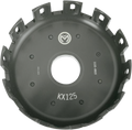 A black metal motocross clutch basket labeled KX125 with circular vents and grooves around the edge, a large central hole, and white manufacturer markings. The basket is used in the engine of a Kawasaki KX125 motorcycle.