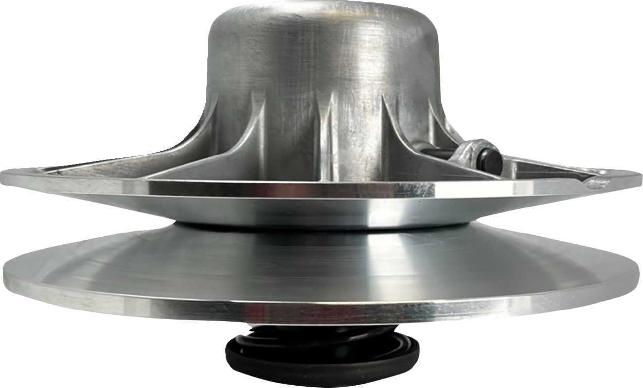A close-up side view of a shiny, metallic mechanical pulley with a wide, flat base and a domed top, featuring radial spokes and bolts. The lower half has a smooth, circular plate connected to a small black spring at the bottom.