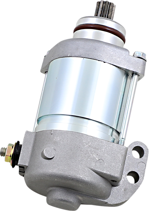 A shiny silver and gray automotive starter motor with a cylindrical body, mounting bracket, visible bolts, and electrical terminal. The metal surfaces are clean and reflective, showing industrial detailing and mechanical components. The starter is set aga