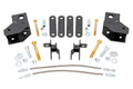 A 2 Inch Lift Kit for Mahindra Roxor featuring black metal brackets, plates, bolts, nuts, washers, and two braided steel hoses neatly arranged on a white background—ideal components for easy vehicle installation.