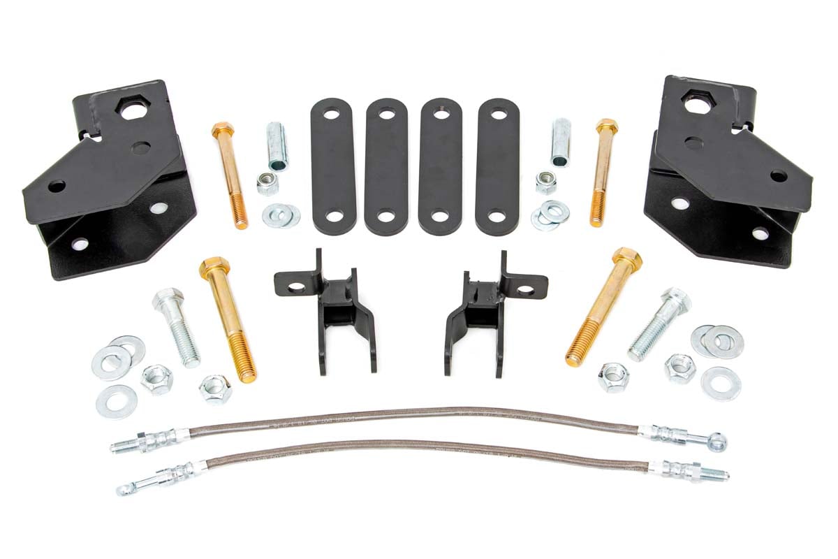 A 2 Inch Lift Kit for Mahindra Roxor featuring black metal brackets, plates, bolts, nuts, washers, and two braided steel hoses neatly arranged on a white background—ideal components for easy vehicle installation.
