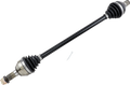 A black automotive CV axle shaft with joint boots on both ends, metal fittings, and exposed splined ends. A small metal pin lies nearby on a light gray background. The component is used in vehicle drivetrains.