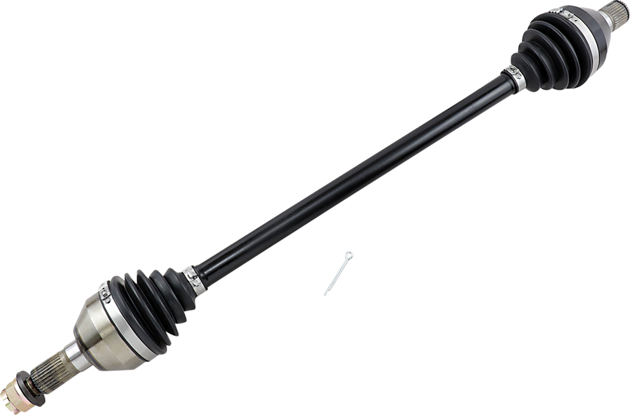 A black automotive CV axle shaft with joint boots on both ends, metal fittings, and exposed splined ends. A small metal pin lies nearby on a light gray background. The component is used in vehicle drivetrains.