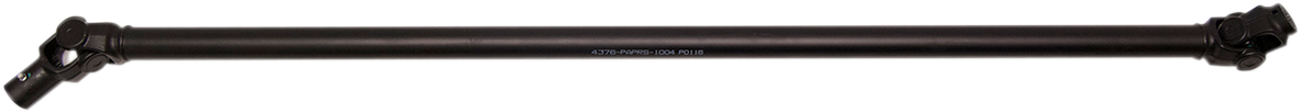 A black metal driveshaft with universal joints at both ends, shown against a plain white background. The cylindrical shaft is labeled with white text in the center. This component is commonly used in automotive drivetrains.