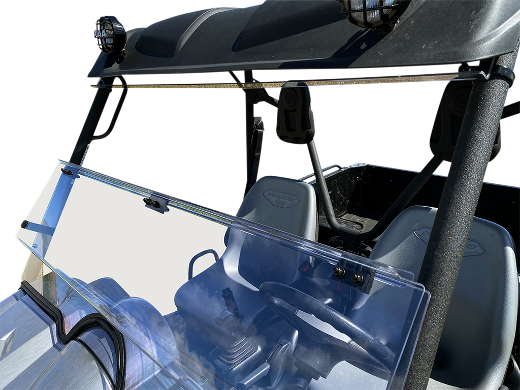 A clear, split windshield is installed on a black off-road utility vehicle. The windshield has two sections, with the top section tilted open. The image focuses on the windshield and front seats, with the steering wheel and dashboard visible.