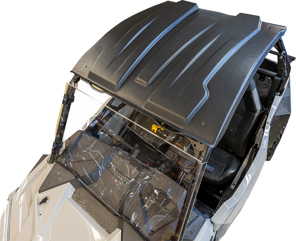 A top-down view of a white off-road vehicle with a black, contoured hard roof and a clear windshield. The interior and steering area are partially visible, showcasing rugged design and seating for two. The background is plain and uncluttered.