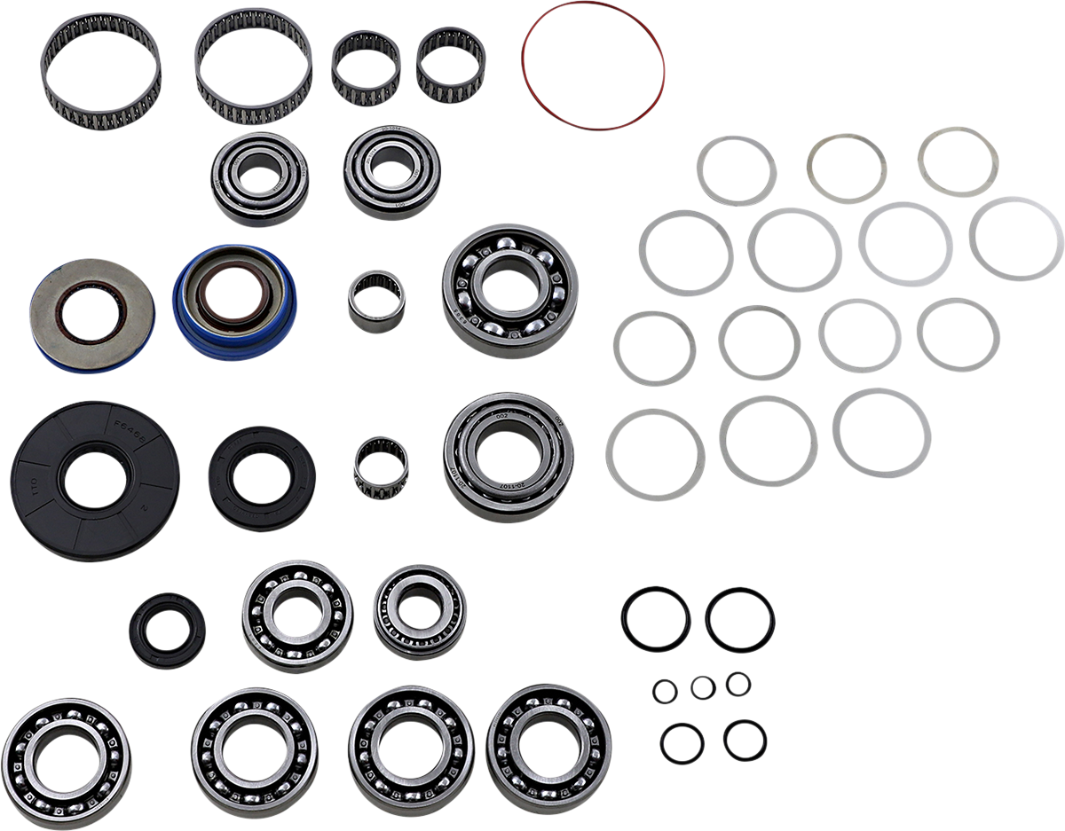 A collection of mechanical parts arranged on a white background, including various sizes of ball bearings, needle bearings, oil seals, rubber O-rings, and metal washers. The components are neatly grouped by type and size in a grid-like pattern.
