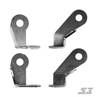 Four identical S3 Power Sports 2019+ Honda Talon 64 Rear Double Shear Brackets with flat bases and angled upright arms, each featuring a large round hole near the top. The brackets are shown in various orientations on a white background. SX logo at bottom