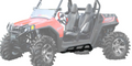 A pair of Polaris RZR 800 Nerf Bars/Tree Kickers is shown attached to a red off-road vehicle with rugged tires, black bucket seats, a roll cage, and side rails. The vehicle is angled left with a faded background highlighting its features.