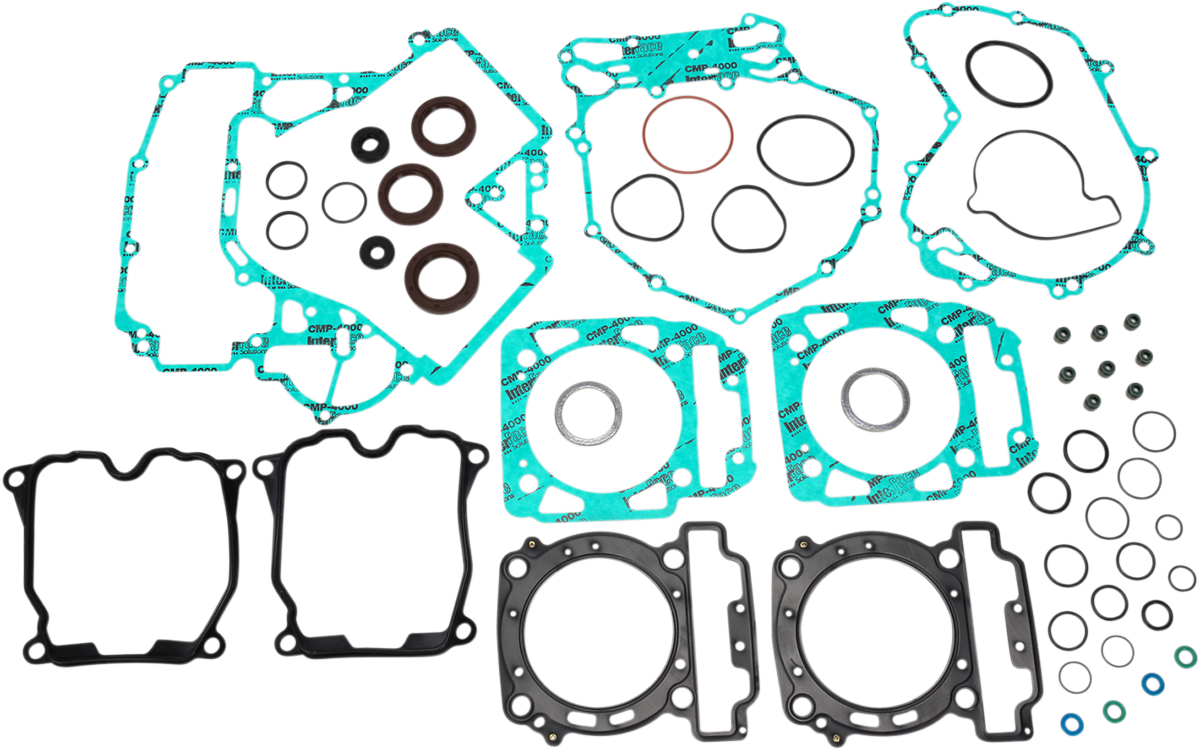 A collection of assorted gaskets and seals, mainly in green, black, and metal, arranged on a white background. The set includes various shaped head gaskets, O-rings, and washer gaskets, likely for an engine repair kit.