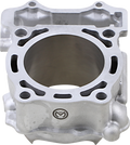 A close-up of a silver metal engine cylinder block with a large central bore, multiple bolt holes around the rim, and a small engraved logo on the lower front side. The block has a smooth machined surface and visible contours for mechanical fitting.