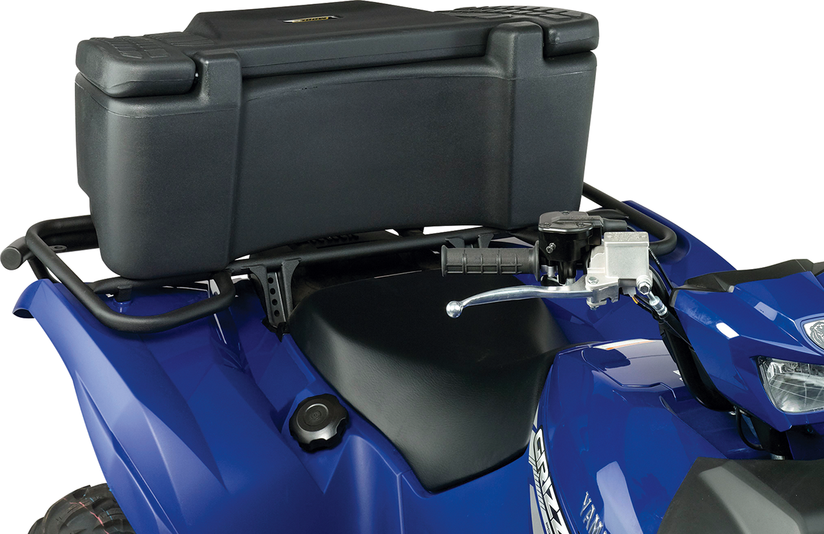 Close-up of a blue ATV with a black storage box mounted on the rear rack. The box has grooved handles and sits above the black seat and metal frame. The ATV’s handlebar and control levers are partially visible on the right.