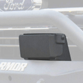Close-up of a 2017-2020 Ford F-150 Stealth Front Bumper Accessory Adaptive Cruise Control Module in texture black, mounted on the front bumper. A blurred Ford logo and partial ARMOR text are visible in the background.