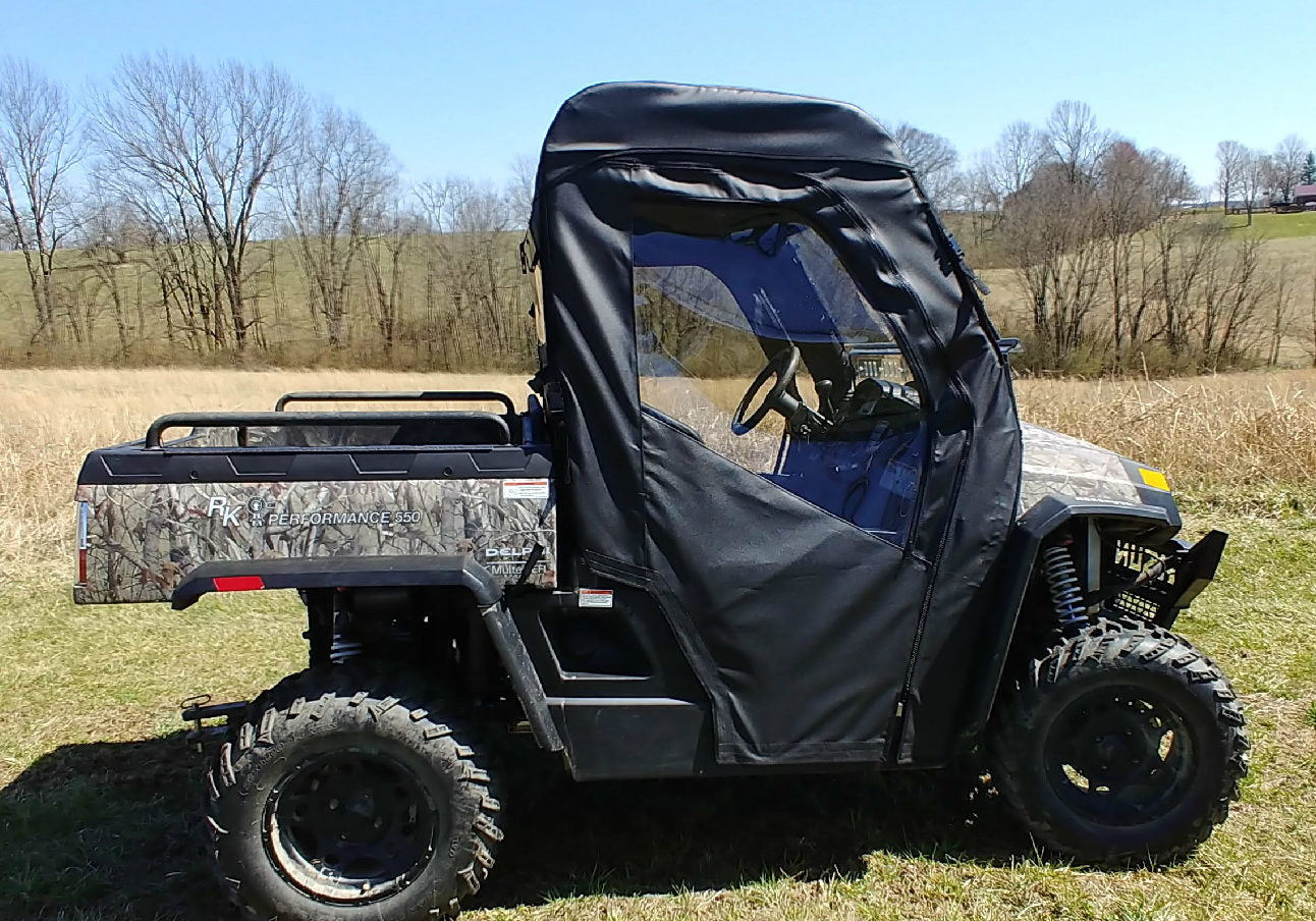 A Hisun Sector 550/750, Bennche Cowboy 500/700, Home Depot Vector 700, Massimo Knight 500/700, or Coleman Outfitter 400 UTV with a soft door kit and clear windows is parked on grass in a rural field with leafless trees and rolling hills.