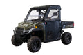 A green Polaris Ranger XP (2013-18) Full Size Pro-Fit with Framed Door Kit, rugged tires, clear windows, and rear cargo bed is shown from a front-side angle against a white background.