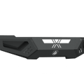 The 2010-2018 Ram 2500 Spartan Front Bumper by Road Armor features a modern, rugged texture black finish with geometric cutouts, vent-like side details, and a centered engraved logo—ideal for off-road or protective use.