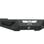 The 2010-2018 Ram 2500 Spartan Front Bumper by Road Armor features a modern, rugged texture black finish with geometric cutouts, vent-like side details, and a centered engraved logo—ideal for off-road or protective use.